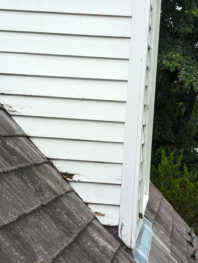 An improperly flashed dormer-roof connection, resulting in rotting.